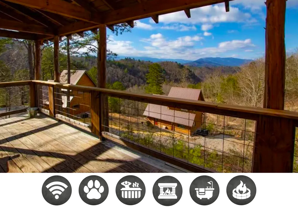 The image showcases the exterior of a charming wooden cabin, featuring a spacious deck overlooking breathtaking mountain vistas and lush greenery. Comfortable seating on the deck invites guests to relax outdoors, while an adjacent cabin suggests privacy without isolation. The serene setting is perfect for sipping coffee, grilling, or stargazing under the clear Tennessee sky.